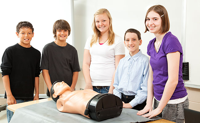 High School Kids Learning CPR and First Aid Training