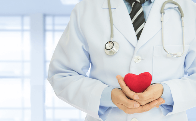Doctor Caring about a Heart and Heart Health