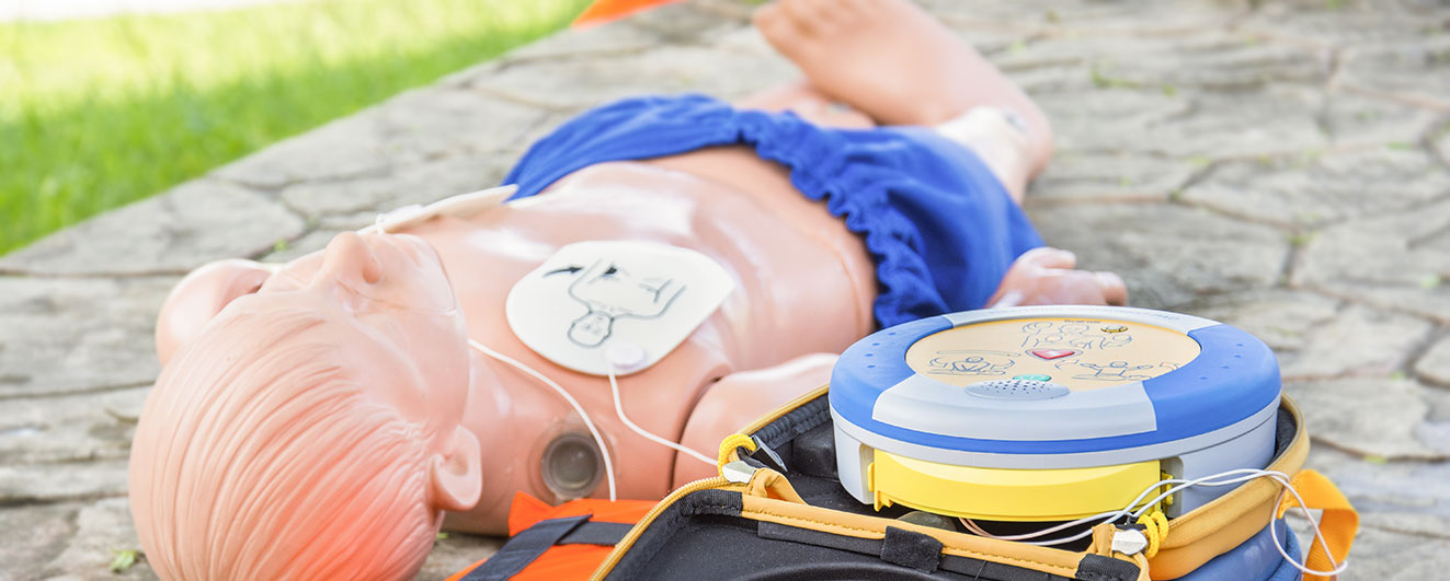First Aid dummy with defibrillator on in training
